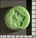 ECSTASY MIMIC TABLET (CONTAINING BENZYLPIPERAZINE (BZP), METHAMPHETAMINE, AND CAFFEINE) IN SIKESTON, MISSOURI Photo 1 The Missouri State Highway Patrol Troop E Laboratory (Cape Girardeau) recently received one round, green tablet with a poorly defined logo, suspected “Ecstasy” (see Photo 1). The tablet was seized in Sikeston, Missouri by the Sikeston Department of Public Safety (details sensitive;