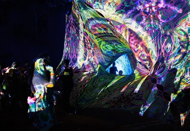 Goa trance party. Trance visuals. The psychedelic visuals projected by light are created on the fly using AI projection software from a bank of AI generated images and videos, so they should be copyright-free in most jurisdictions. Goa trance party, Upper Mandrem, Goa, India.